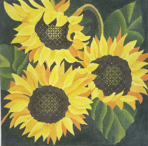 dede's needlepoint canvas featuring three yellow sunflowers with dark brown centers and green leaves on a dark background.