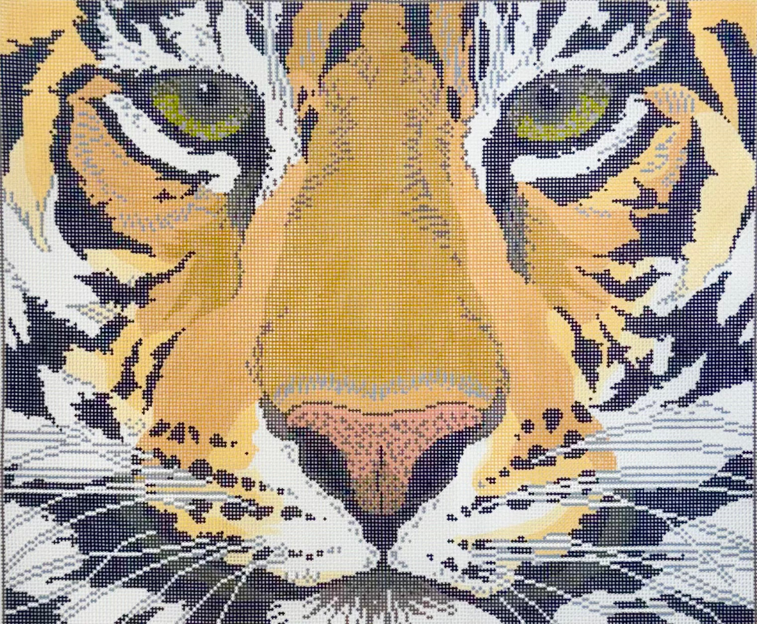 Lee's Needle Art needlepoint canvas of a close-up of a tiger's face with orange, black, white, yellow, and pink tones forming the animal's eyes, nose, and facial markings.