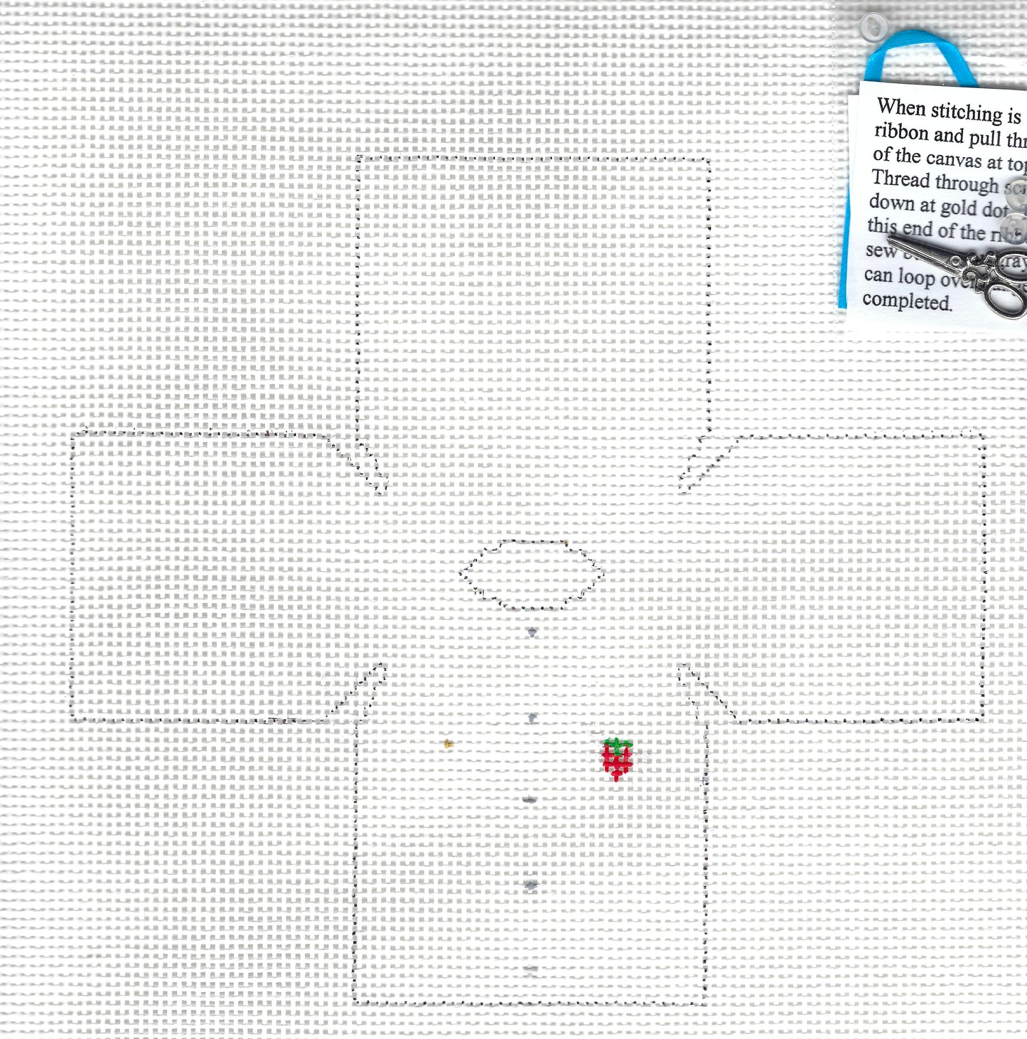 The Studio Midwest needlepoint topper canvas with a large outlined cross-looking shape, a small oval in the center, and a note explaining thread and ribbon use.