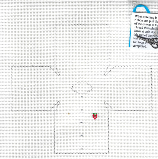 The Studio Midwest needlepoint topper canvas with a large outlined cross-looking shape, a small oval in the center, and a note explaining thread and ribbon use.