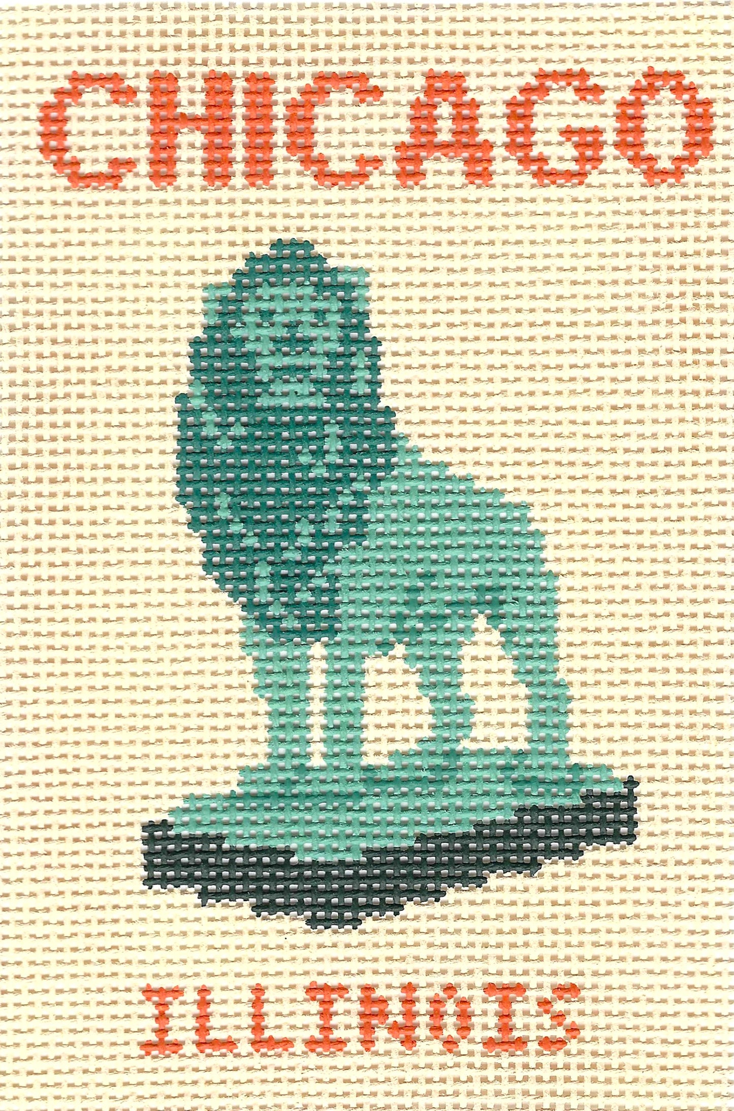 Atlantic Blue Canvas needlepoint canvas featuring a design of the Chicago lion statue in teal, with the word 'CHICAGO' in orange-red at the top and 'ILLINOIS' at the bottom on a cream background.