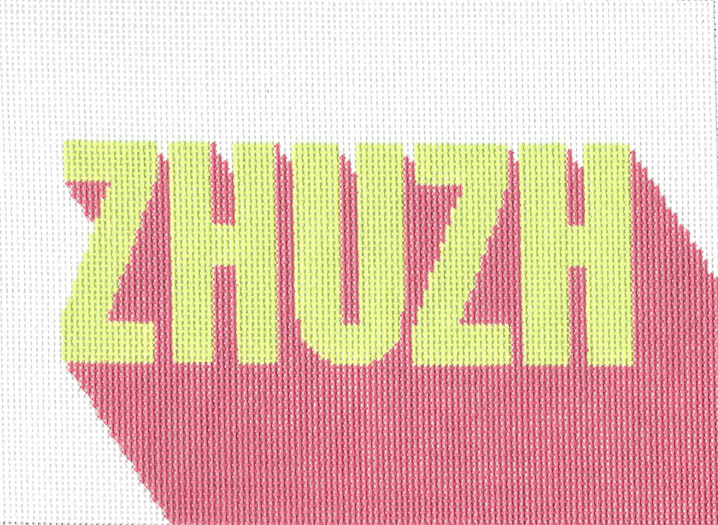 Threaded & Tipsy needlepoint canvas of the word 'ZHUZH' in light yellow-green letters over a pink shadow-like shape on a white background.